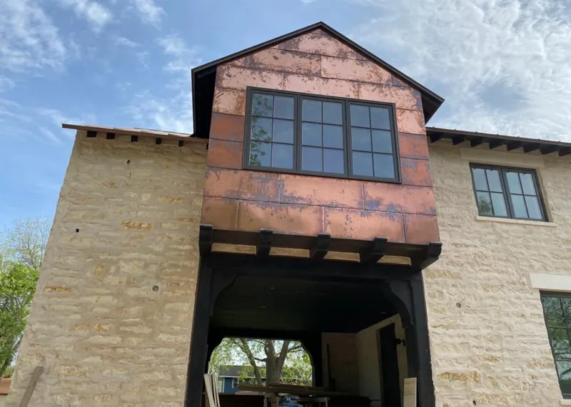 Copper metal panel facade on a stone building for Metal Roof Coating in Upper Saddle River